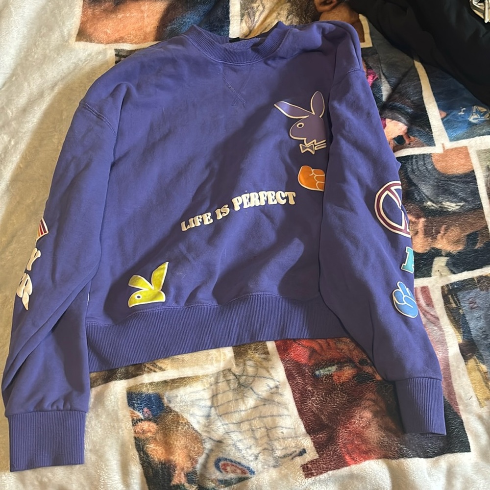 Playboy crewneck size xtra small fits small and is purple